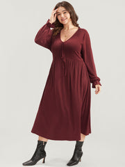 Solid Lantern Sleeve Tie Neck Pocket Rib Knit Dress