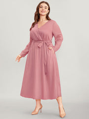 Solid Pocket Belted Surplice Neck Midi Dress