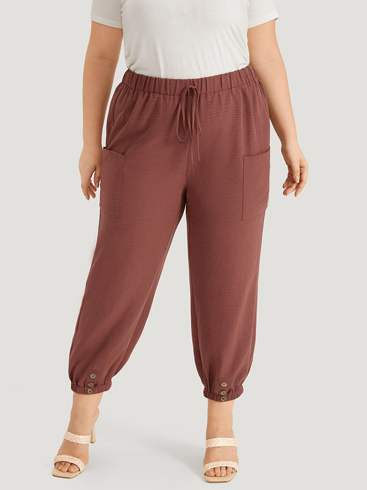 Solid Patched Pocket Bowknot Button Detail Pants