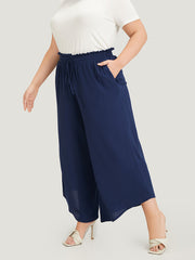 Solid Paperbag Waist Asymmetrical Hem Wide Leg Pants