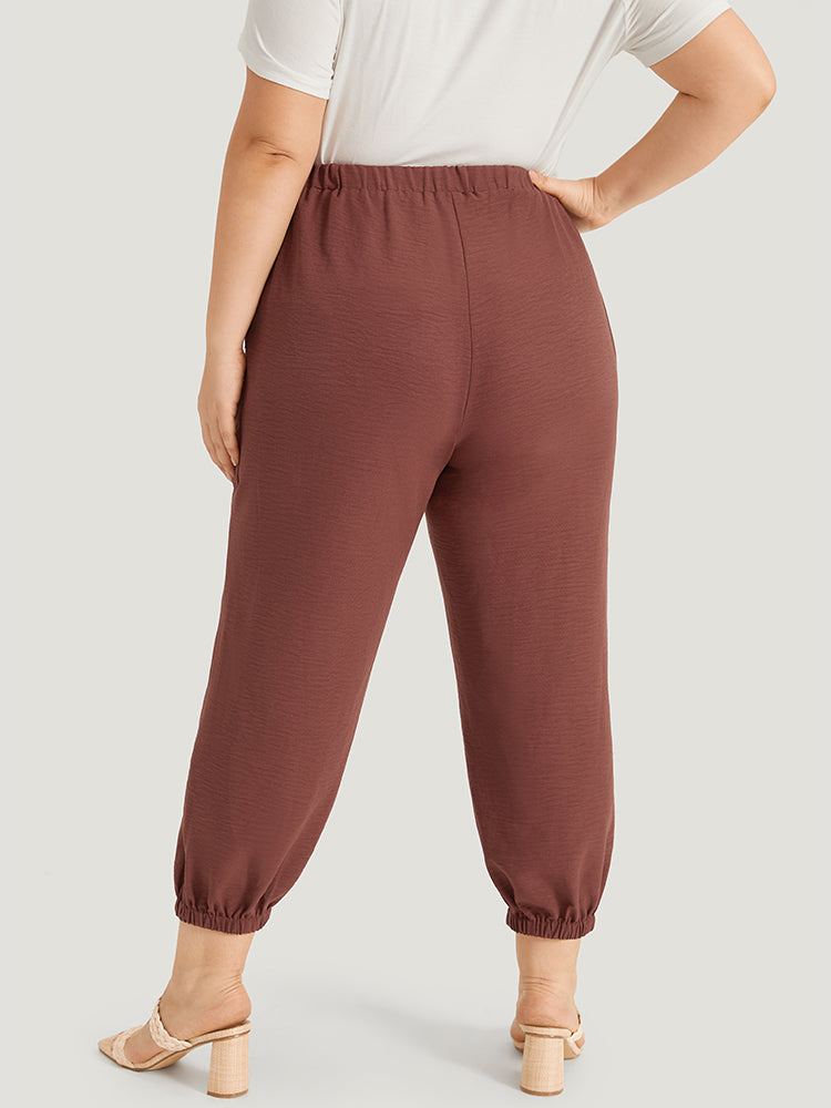 Solid Patched Pocket Bowknot Button Detail Pants